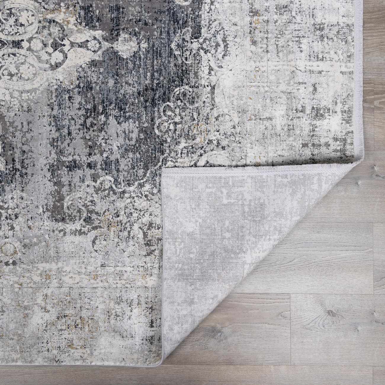 Calion Distressed Charcoal Luxury Fringed Faux Silk Rug