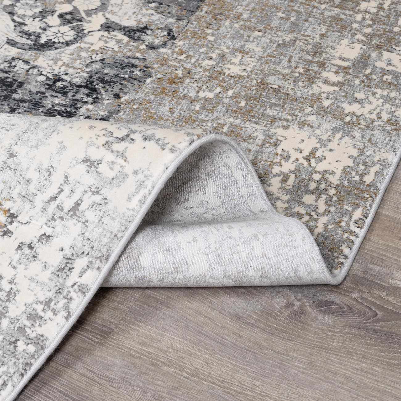 Calion Distressed Charcoal Luxury Fringed Faux Silk Rug