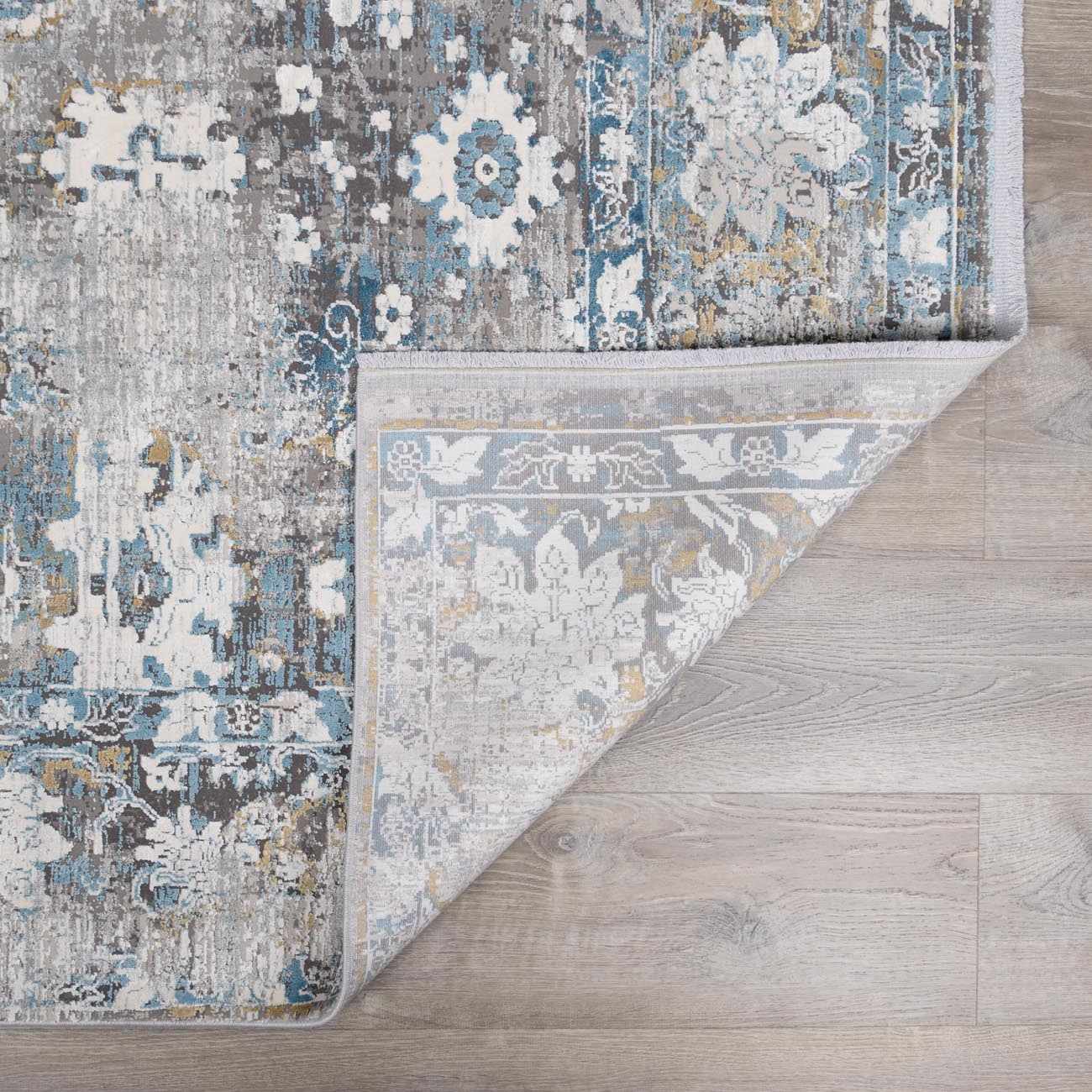 Meggett Luxury Fringed Faux Silk Rug