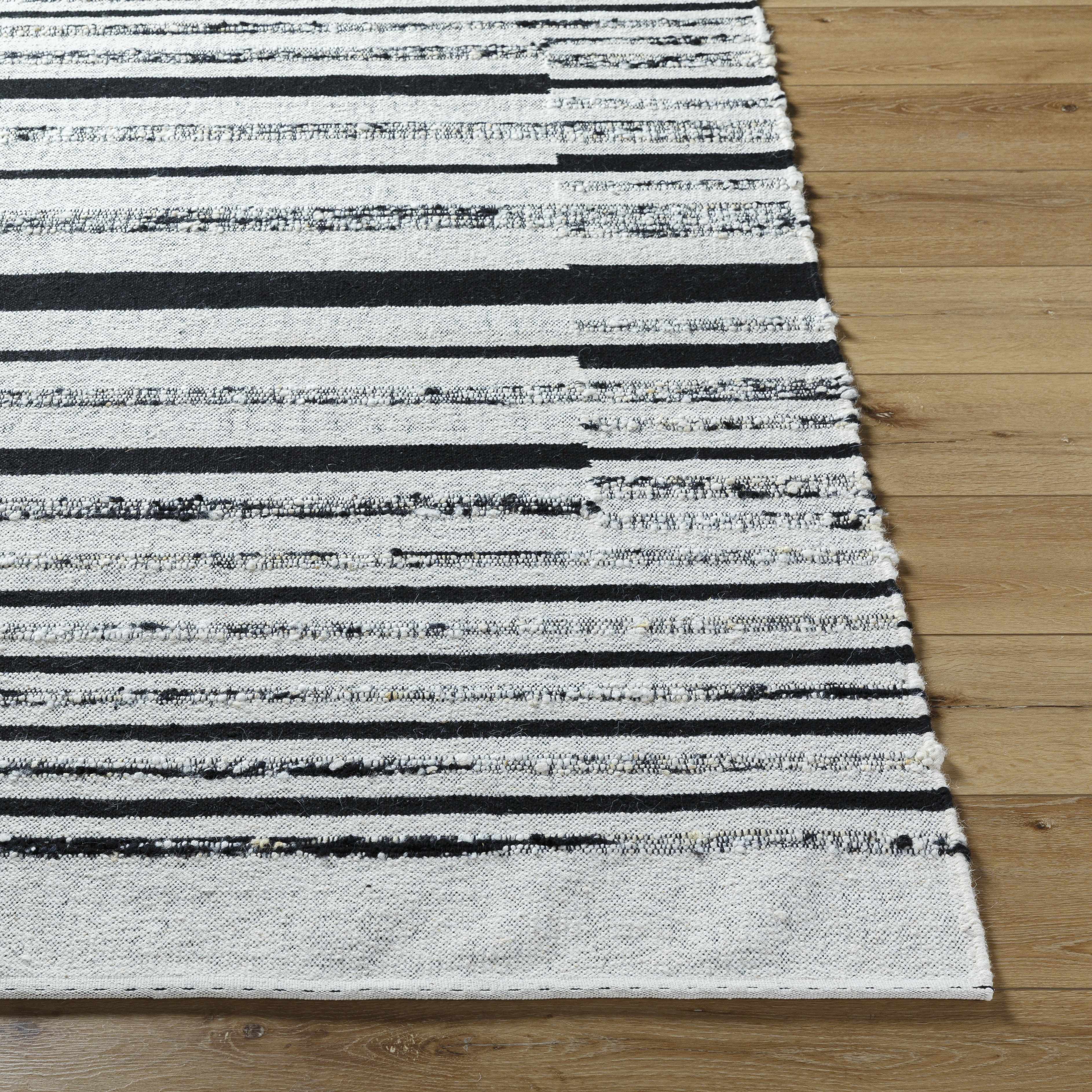 Artfully Subtle Black Hand Woven Wool & Cotton Area Rug